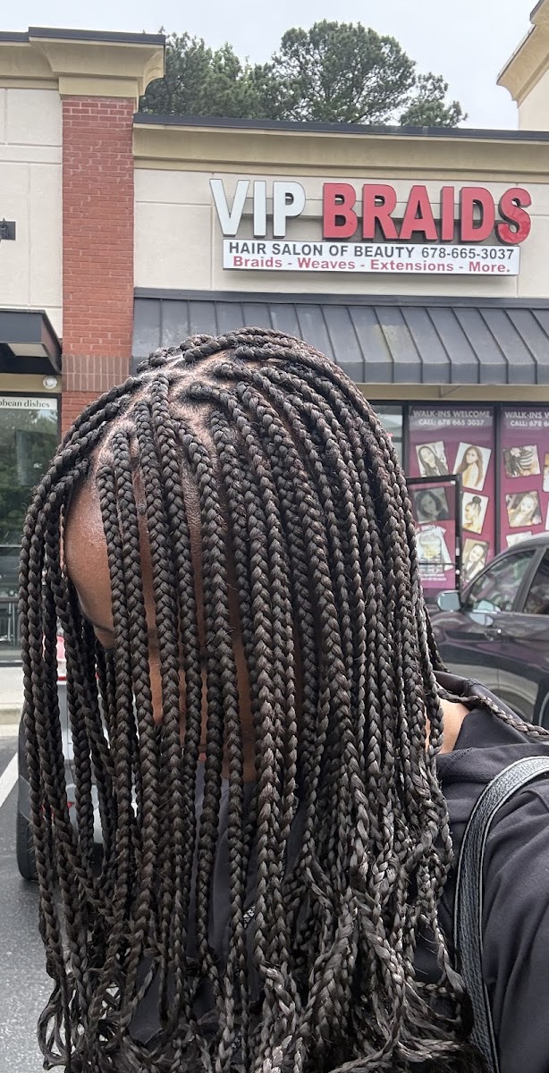 Long knotless braids styled by VIP Braids, photographed at the Lawrenceville studio