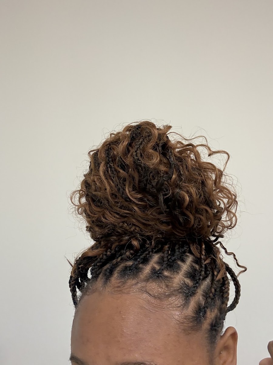 Twisted curly updo styled at VIP Braids